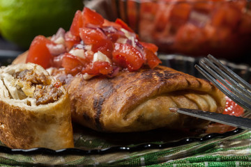 Mexican chimichanga with salsa dip