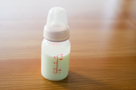 close up bottle of baby milk