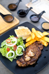 Meat Steak with salad and French Fries and sauce