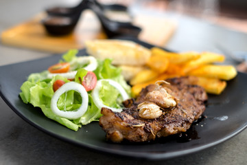 Meat Steak with salad and French Fries and sauce