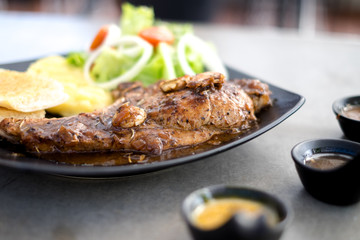 Meat Steak with salad and French Fries and sauce