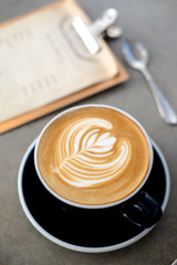 Latte art coffee with glass