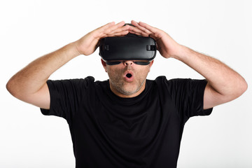 Man looking in VR glasses and gesturing with his hands.