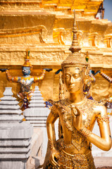 Fototapeta premium Golden angel statue, Interior of the Grand Palace in Bangkok. Thailand.