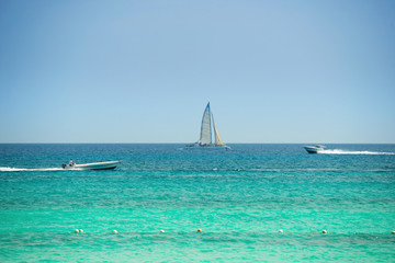 Obraz premium Yacht and boat in the blue sea.