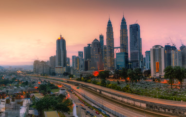 Fototapeta na wymiar Landscape of Kuala Lumpur skyscraper with colorful sunrise sky, Malaysia.