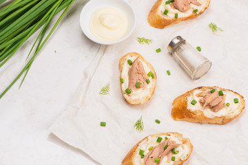 Italian cuisine. Bruschetta with tuna, onion, and mayonnaise.