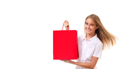 shopping, sale, christmas and holiday-lovely young girl with red shopping bag, isolated with copyspace