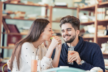 Couple eating sandwich