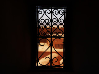 Fototapeta na wymiar Metal grille in the window