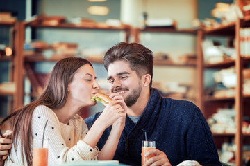 Couple eating sandwich