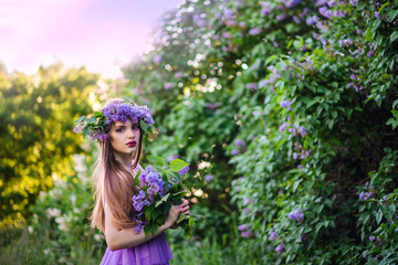 The girl with the wreath on his head in lilac