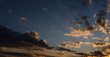 Beautiful sunset sky with orange clouds as natural background.