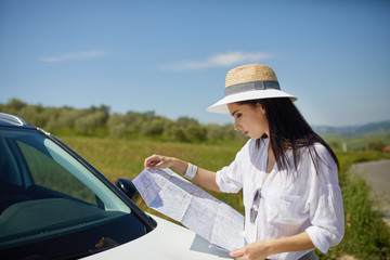 beautiful hat woman holding paper map finding right tourist route