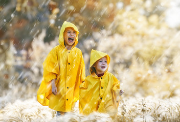 children under the autumn rain