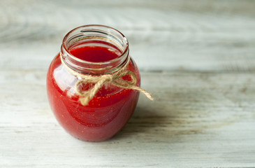 Berry jam in a glass jar. Food Close-up