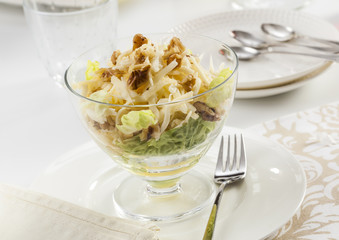 Healthy salad with apple, cheese and walnuts.
