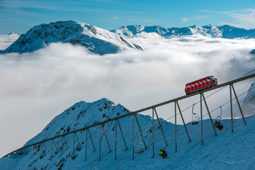 View of alpine Ski Resort Mountain Ridge Clouds and Lift