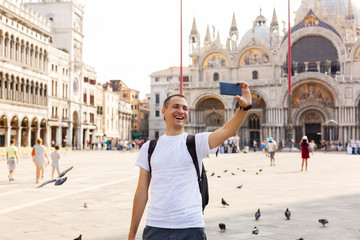 Man makes selfi in the Plaza San Marco in Venice