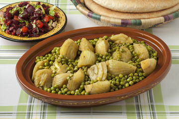 Traditional Moroccan tagine with meat, peas and fennel