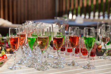 lot of colorful drinks on buffet table