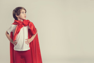 Fototapeta premium Female superhero kid posing in studio