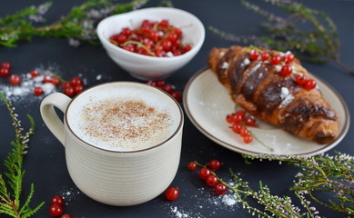 Cup of cappuccino, croissants, redcurrant