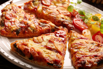 Homemade pizza on a white plate