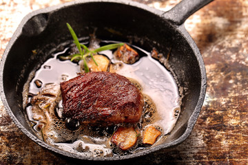 Beef steak on cast iron skillet