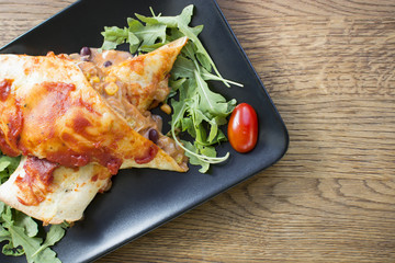 Pancakes with fried meat and vegetables. Pepper, cabbage, parsley in the filling.