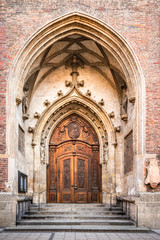 Brown wood old door in the centre of Munich, Germany.