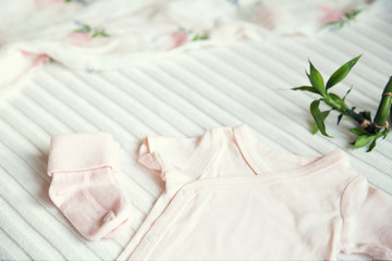 Baby girl clothes. Fabric background.