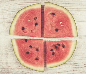 Watermelon on wooden background.