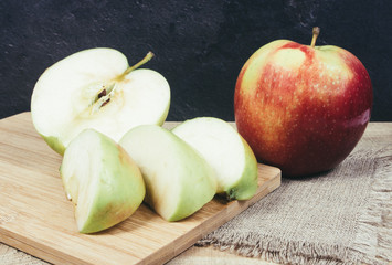 Fresh apple on a wooden background.