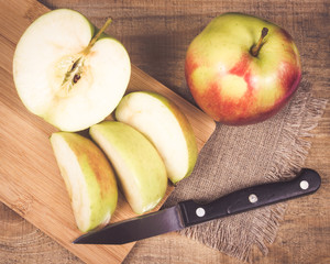 Fresh apple on a wooden background.