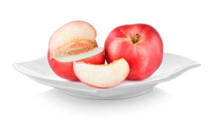 Peach in plate on white background