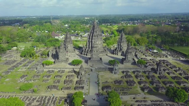 Beautiful aerial footage of ruins Prambanan temple complex from a drone flying forward above the temple in Yogyakarta, Indonesia. Shot in 4k resolution