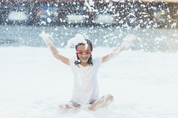 Children having fun in foam party.