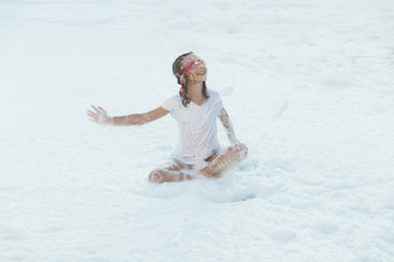 Children having fun in foam party.