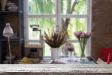 plant and flower in vase near window with garden view. decoration and interior with wood table for display your product