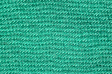 Green Denim Textile Texture Close-up. Macro Snapshot of Tissue Structure