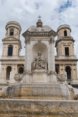 Fototapeta na wymiar Paris, place Saint-Sulpice, the fountain with the church in background