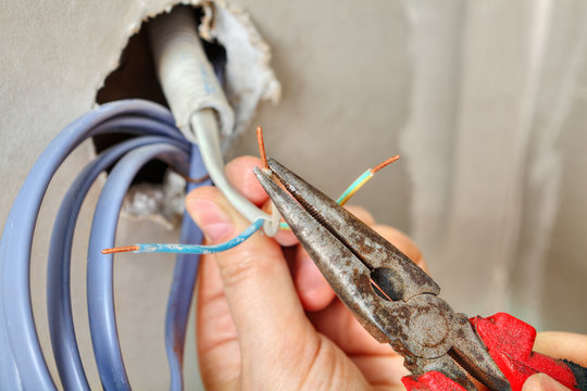 Install an electrical outlet, strip cables before pulling them.