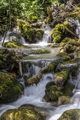 Fototapeta na wymiar Waterfalls in a mountain stream