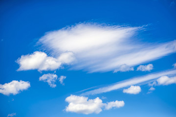 Fluffy clouds on azure blue sky