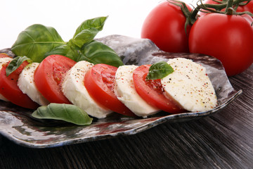 Caprese salad with tomatoes, mozzarella and basil.