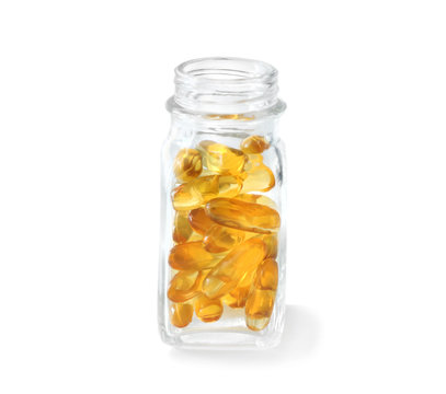 Bottle with fish oil capsules on white background