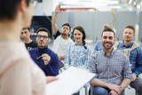 Groupmates listening to lecturer or speaker at conference