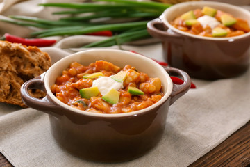 Casserole with delicious chili turkey on napkin