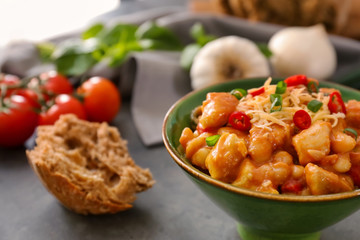 Bowl with delicious turkey chili on table